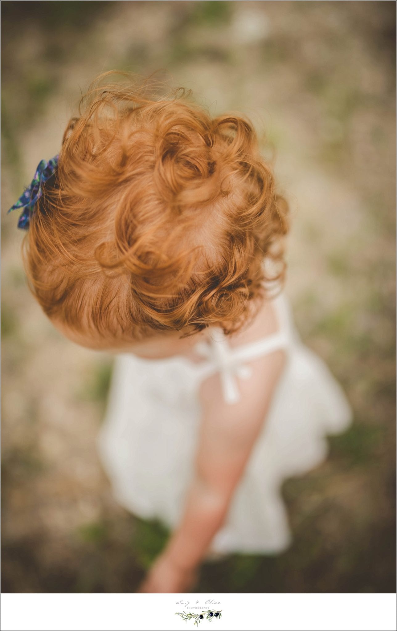 white dress, blue hair flower, red hair